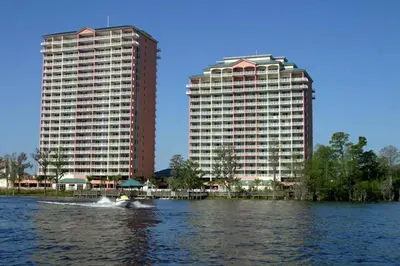 a boat in the water in front of two tall buildings at Condo Blue Heron in Orlando