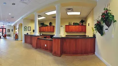 a lobby with wooden counters in a building at Penthouse Blue Heron Condo in Orlando