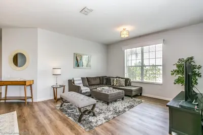 a living room with a couch and a table at Casa Maria Condo in Orlando