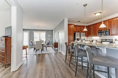a kitchen and dining room with a table and chairs at Casa Maria Condo in Orlando