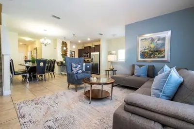 a living room with a couch and a table at Five Bedrooms TownHome with Pool 4849 in Kissimmee