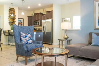 a living room with a couch and a table at Five Bedrooms TownHome with Pool 4849 in Kissimmee