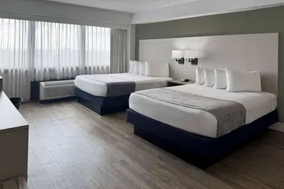 two beds in a hotel room with two beds sidx sidx sidx at Wyndham I-Drive Avanti Resort & Conference Center in Orlando