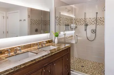 a bathroom with two sinks and a shower at Marriott's Lakeshore Reserve in Orlando