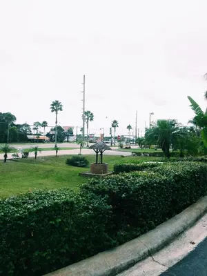 a park with a statue in the middle of a street at The keys in Kissimmee