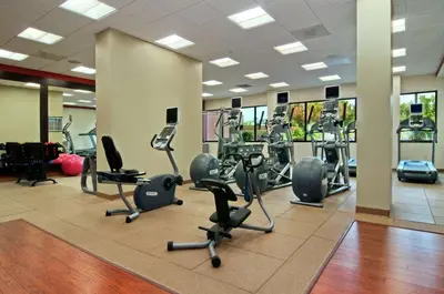 a gym with several treadmills and elliptical machines at Hilton Orlando/Altamonte Springs in Orlando