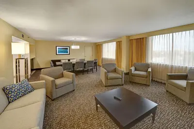 a living room with a couch and chairs and a table at Hilton Orlando/Altamonte Springs in Orlando