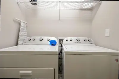 a kitchen with a stove and a dishwasher at Four Bedrooms TownHome 5122 in Kissimmee