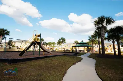 a playground with a slide in a park at Four Bedrooms TownHome 5122 in Kissimmee