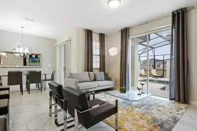 a living room with a couch and a table at Four Bedrooms w/ Pool TownHome 4841 in Kissimmee