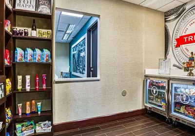 a grocery store aisle with a window and a refrigerator at Hampton Inn & Suites Orlando-East UCF in Orlando
