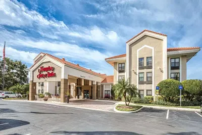 a rendering of the front of a hotel at Hampton Inn & Suites Orlando-East UCF in Orlando