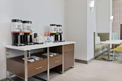 a room with a counter with coffee machines on it at Hampton Inn & Suites Orlando International Drive North in Orlando