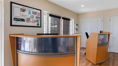 a room with two tables and a wall at Bluegreen Vacations Orlando's Sunshine Resort in Orlando