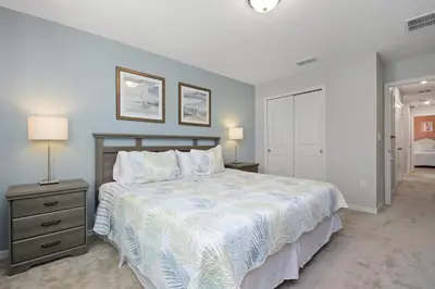 a bedroom with a large bed and two lamps at Four Bedrooms Resort TownHome 5128 in Kissimmee
