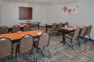 a conference room with tables and chairs in it at Hampton Inn Closest to Universal Orlando in Orlando