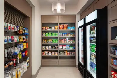 a grocery store aisle with food and drinks at Residence Inn by Marriott Orlando at Millenia in Orlando
