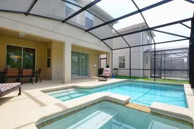 an indoor swimming pool with a glass ceiling at DISNEY area Luxurious House-Private Pool in Kissimmee