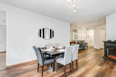 a dining room with a table and chairs and a fireplace at Newly Renovated 1st-Floor Condo at Vista Cay in Orlando