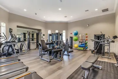 a gym with treadmills ellipticals and exercise machines at Vista Cay Condo w FREE Resort Access, near Disney in Orlando