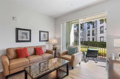 a living room with a couch and a table at Cozy Condo w FREE Vista Cay Resort Access in Orlando
