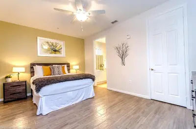 a bedroom with a bed and a ceiling fan at Lovely Condo w FREE Access to Resort Amenities in Orlando