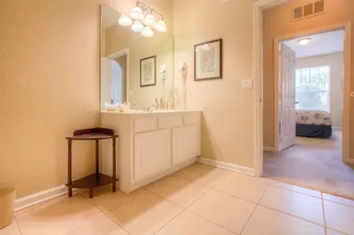 a bathroom with a sink and a mirror at Lovely Vista Cay Resort Condo, Near ClubhousePool in Orlando