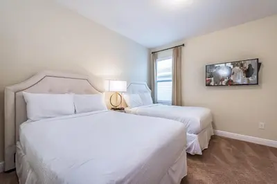 a hotel room with two beds and a window at Welcoming Home With Private Pool Near Disney With Waterpark & Resort Access At Encore Resort - 761La in Kissimmee