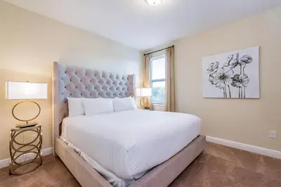 a bedroom with a large white bed and a window at Welcoming Home With Private Pool Near Disney With Waterpark & Resort Access At Encore Resort - 761La in Kissimmee