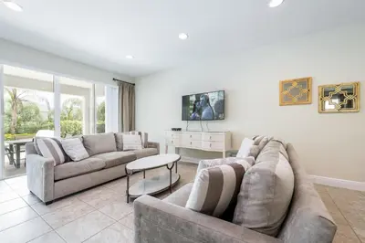 a living room with two couches and a table at Elegant Home Near Disney With Private Pool And Waterpark & Resort Access At Encore Resorts Reunion - 621La in Kissimmee