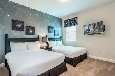 two beds in a room with stars on the wall at Vibrant Home Near Disney With Private Pool, Themed Rooms And Waterpark & Resort Access At Encore Resorts Reunion - 401No in Kissimmee