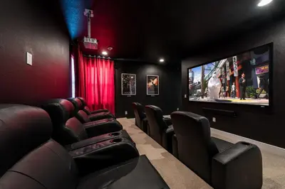 a cinema room with chairs and a flat screen tv at Grand Home Near Disney With Private Pool, Media And Themed Rooms With Waterpark & Resort Access At Encore Resorts Reunion - 360Bu in Kissimmee
