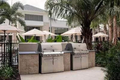 a outdoor kitchen with two burners on a patio at SpringHill Suites by Marriott Orlando Theme Parks Lake Buena Vista in Orlando