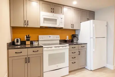 a kitchen with white appliances and a white refrigerator at WorldMark Orlando Kingstown Reef in Orlando