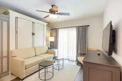 a living room with a couch and a table at WorldMark Orlando Kingstown Reef in Orlando