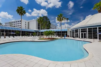 a large swimming pool in front of a building at Holiday Inn Resort Kissimmee by the Parks by IHG in Orlando
