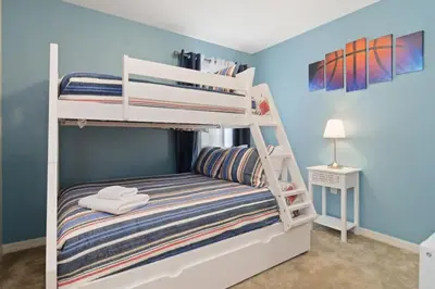 a bedroom with two bunk beds in a room at Four Bedroom with GameRoom 5150A in Kissimmee