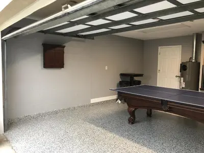 an empty room with a ping pong table in it at Mickeys Landing - Luxurious 4BR with 2 Master Suites, Privacy Fenced Pool & Hot Tub BBQ Game RM 2 miles to Disney! in Orlando