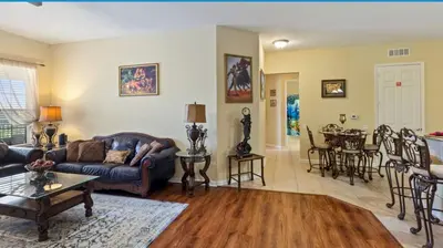 a living room with a couch and a table at Executive 3 Bedroom Villa at Universal,Convention Center, Vista Cay in Orlando