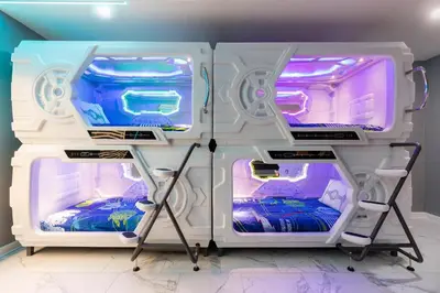 an open refrigerator with two beds in a room at Modern Luxury Villa with Everything in Kissimmee