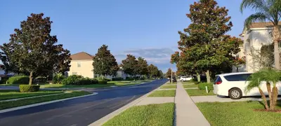 a white car parked on the side of a street at Flagstone Villa in Orlando