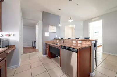 a kitchen with a sink and a dishwasher at Casa Lucia Lakeview Condo in Orlando