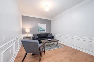 a living room with a couch and a table at Casa Lucia Lakeview Condo in Orlando