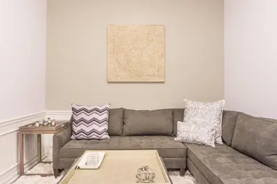 a living room with a couch and a table at Cayview Avenue Unit 404 Condo in Orlando