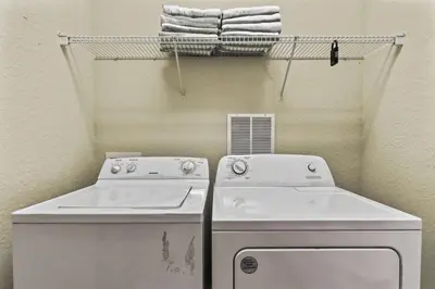a laundry room with a washer and dryer at 4804 Cayview Ave #105 in Orlando
