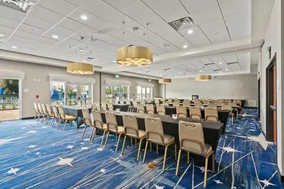 a conference room with a long table and chairs at Holiday Inn Express & Suites Orlando- Lake Buena Vista by IHG in Orlando