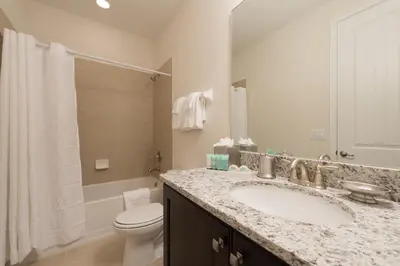 a bathroom with a sink and a toilet at Elegant Home Near Disney With Private Pool And Waterpark & Resort Access At Encore Resorts Reunion - 7393Mr in Kissimmee