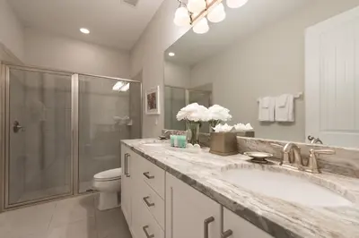 a bathroom with a sink and a shower and a toilet at Exquisite Home With Theater, Themed Rooms Near Disney With Waterpark & Resort Access At Encore Resort- 7664Ff in Kissimmee