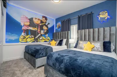 a bedroom with two beds and a mural of a family at Storey Lake Resort Just 5 Minutes to Mickey Mouse in Kissimmee