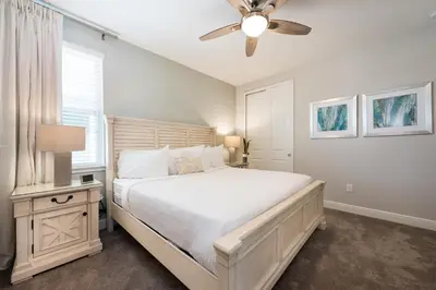 a bedroom with a bed and a ceiling fan at Delightful Home Near Disney With Private Pool, Media Room, Waterpark & Resort Access At Encore Resort Reunion - 7418Mr in Kissimmee